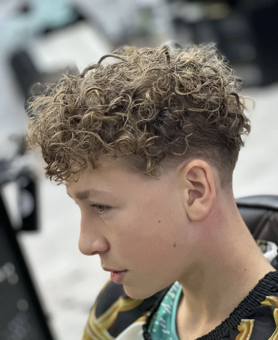 Finished curly perm with a clean skin fade at Prestige Gentleman