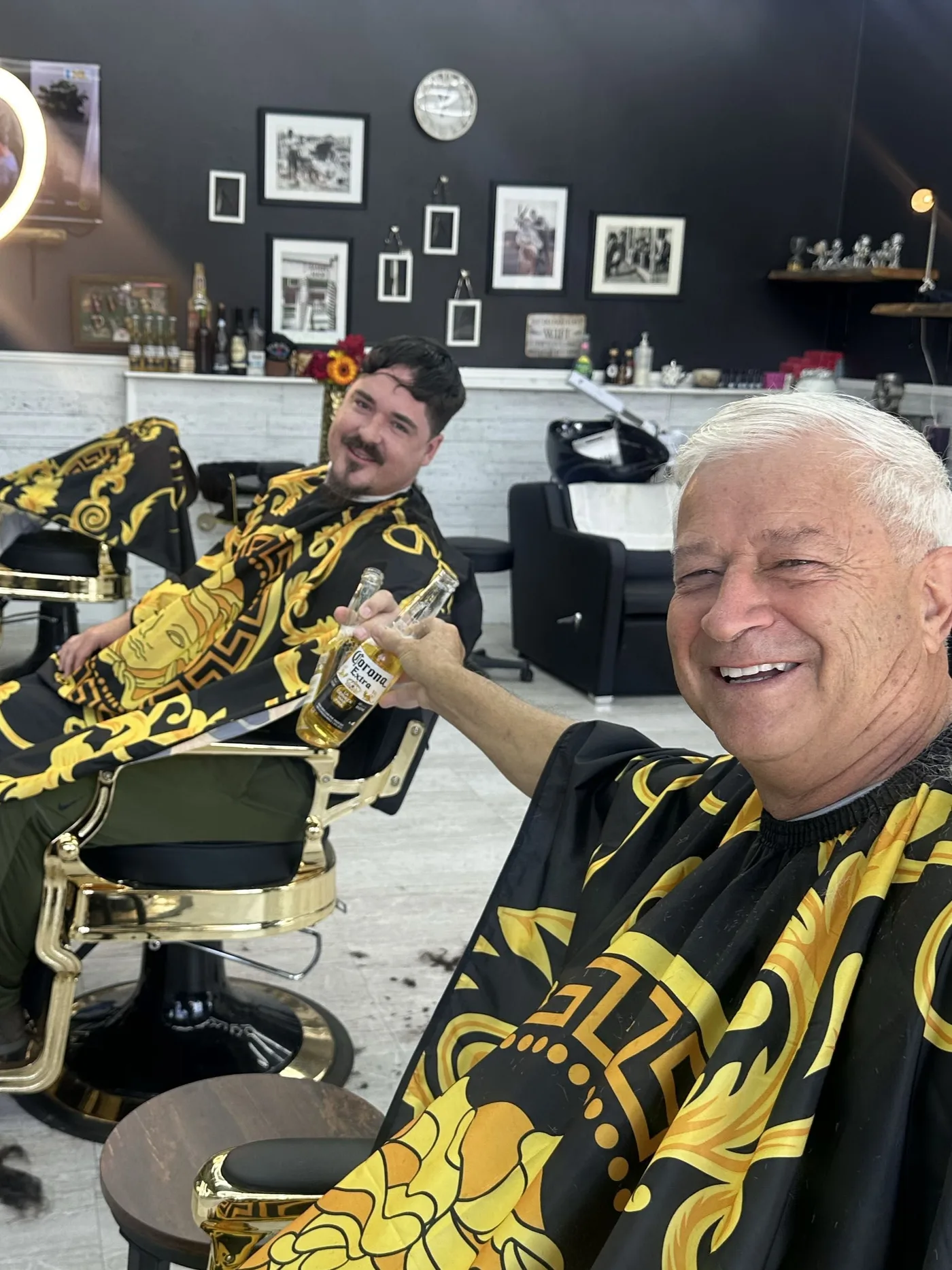 Clients relaxing in gold barber chairs at Prestige Gentleman Hair Studio in Innisfil